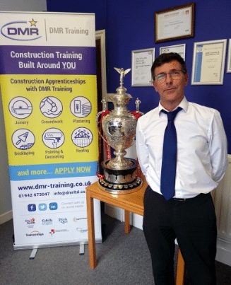 NVQ assessor Steve Graham posing with the Ladbrokes FA Cup