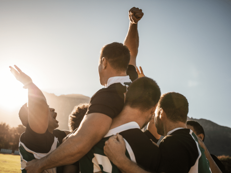 Men playing rugby