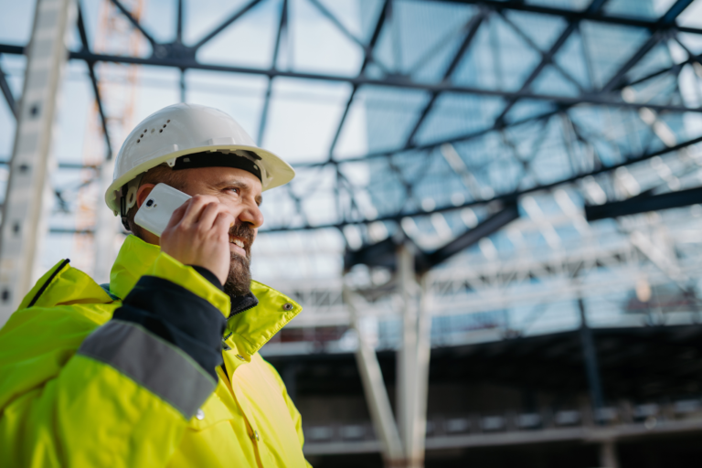 construction site manager taking a phone call