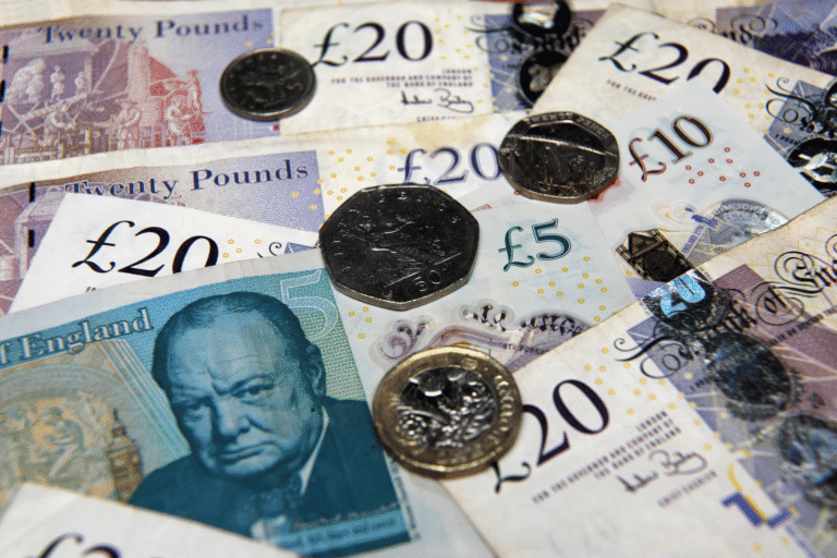 NVQ Funding in the form of bank notes money on a table.